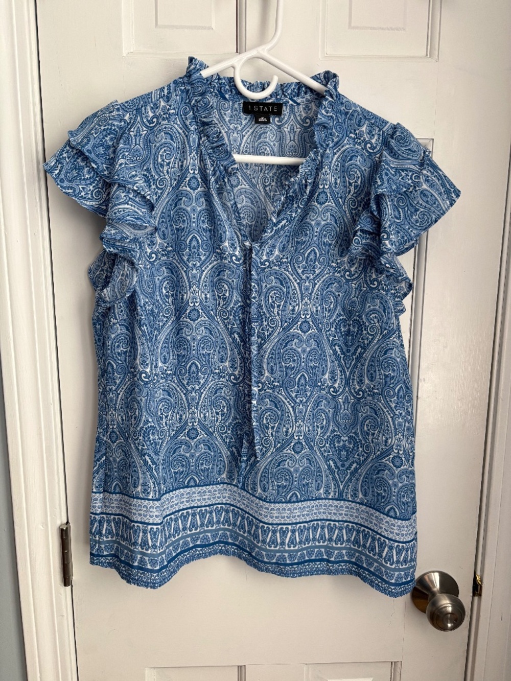 Blue paisley blouse with ruffle sleeves.  Size M